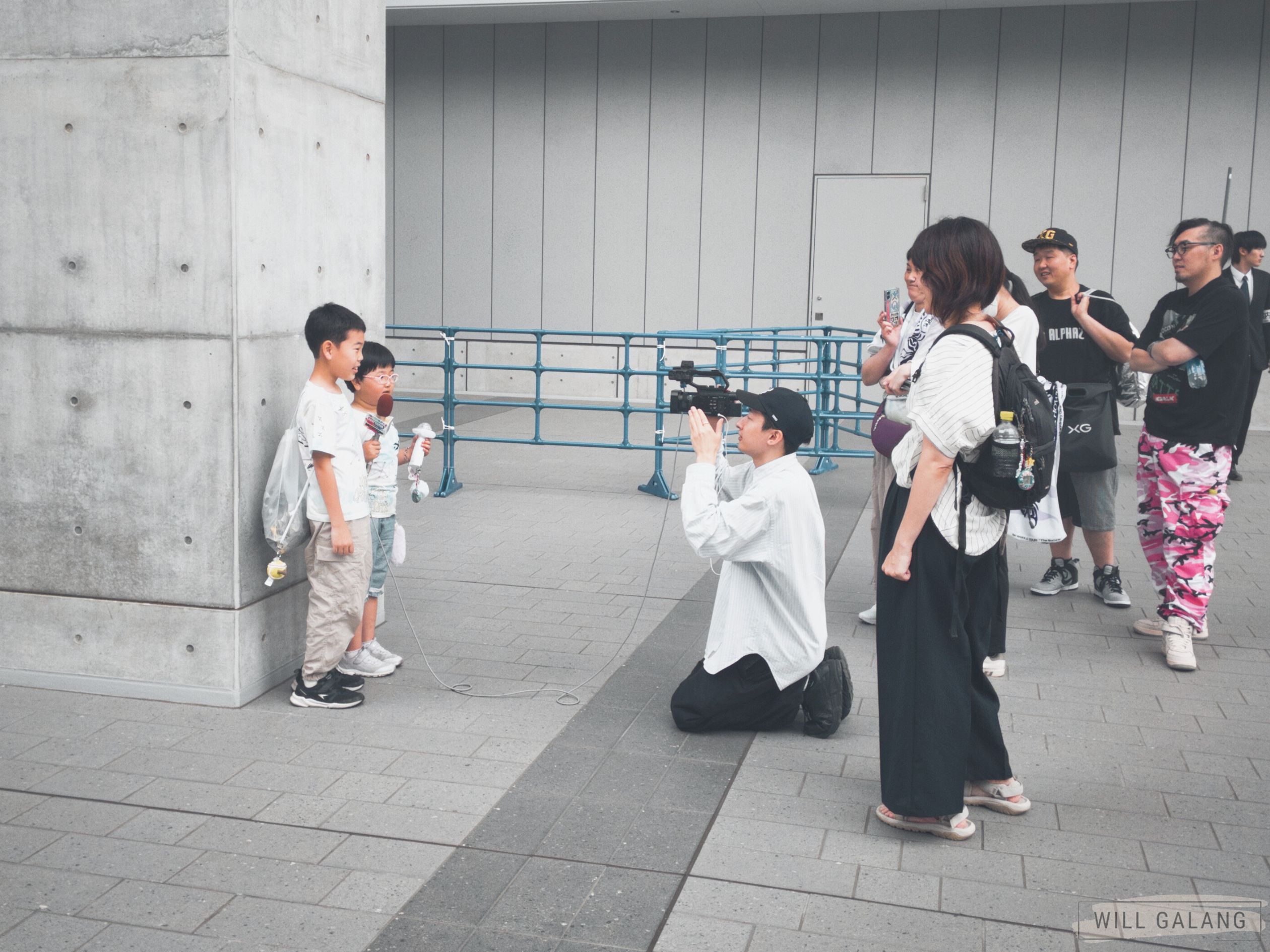 Most likely XGALX people documenting the scenes outside K-Arena before the concert starts.